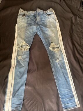 AMIRI Light Blue Distressed Skinny Jeans with White Side Stripes